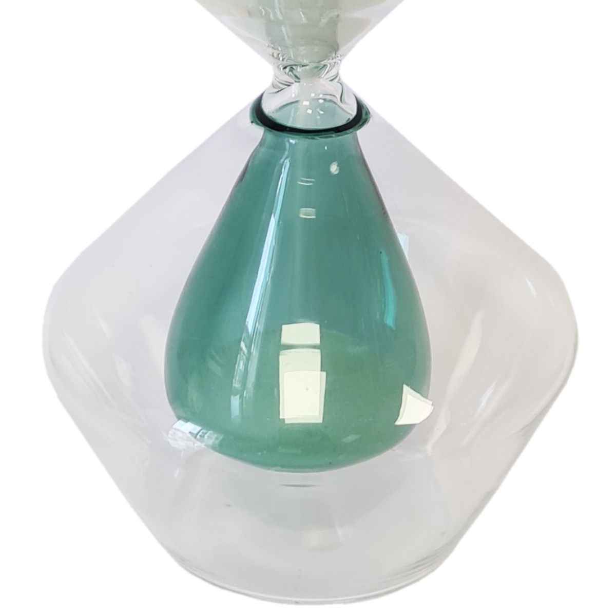 Decorative hourglass in glass and white sand