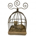 Figurine cat in cage