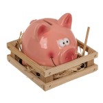 Piggy bank with a little hammer