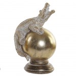 Golden patinated crocodile statuette on resin globe