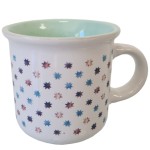 White and green stoneware mug