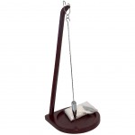 Metal pendulum on wooden stand with sand